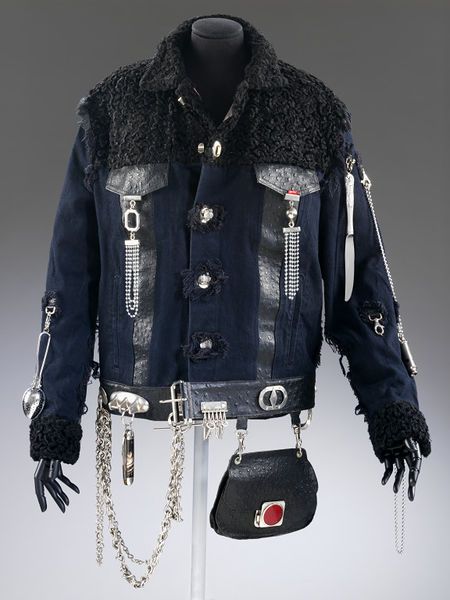 Black denim jacket customised with cutlery, leather and astrakhan