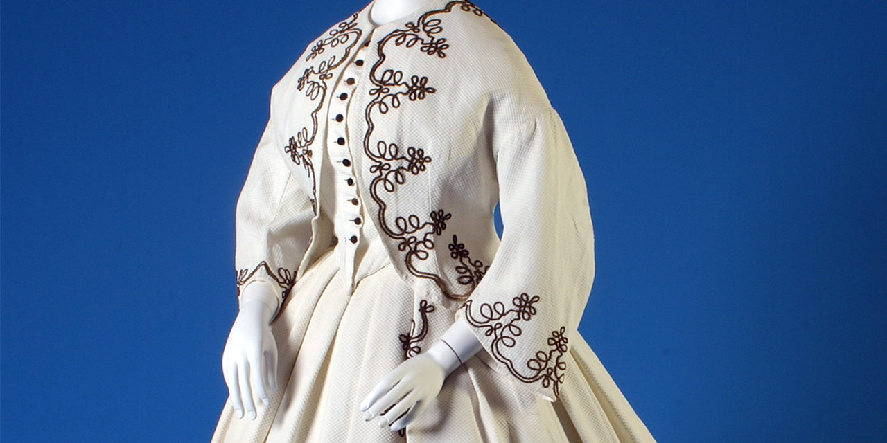 1867 – White piqué afternoon dress with black cording