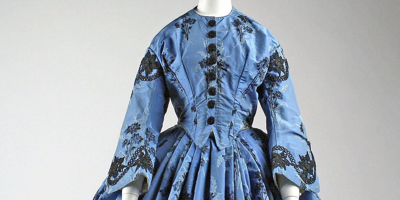 1863 – Blue silk dress with black floral embroidery