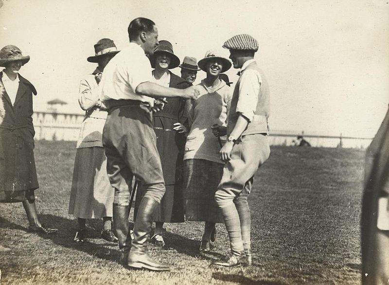 Exchanging jokes at Ascot racetrack, Brisbane, August 1920 Prince of Wales and a group of young socialites enjoying a chat at the racetrack.