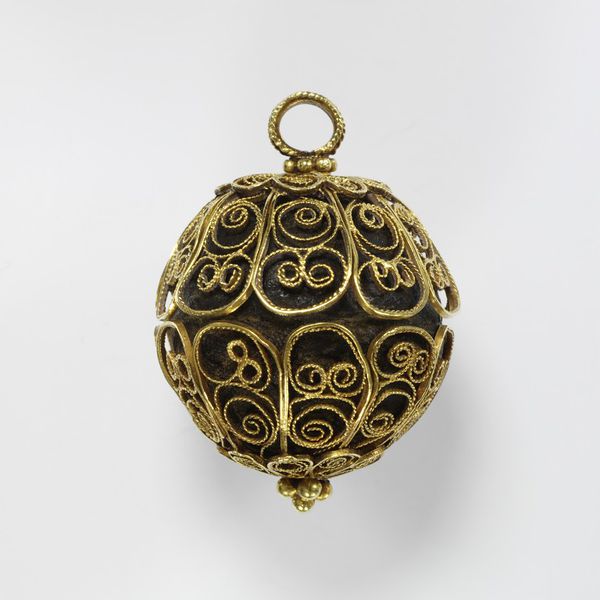 Gold filigree enclosing a ball of ambergris