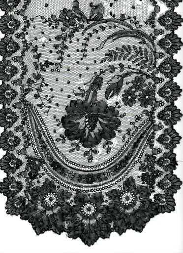 This Black Chantilly lace lappet or scarf is a sample of early Victorian bobbin lace from about 1870. It is of good quality, but fragile. The fine black silk threads are disintegrating. The ends are of higher quality than the center section.