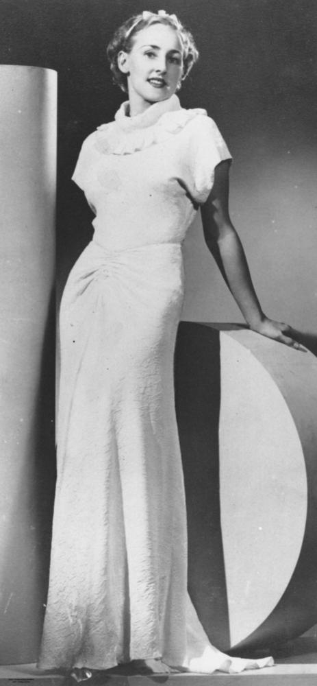 Model posing in a glamorous evening gown