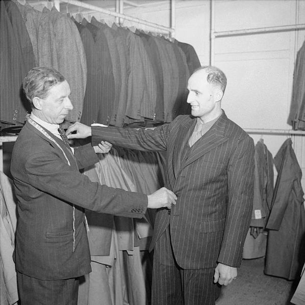 Demobilisation of British Service Personnel. Sergeant H Minnall from Chiswick, London, is fitted with his civilian suit at the demobilisation centre at Olympia, London.