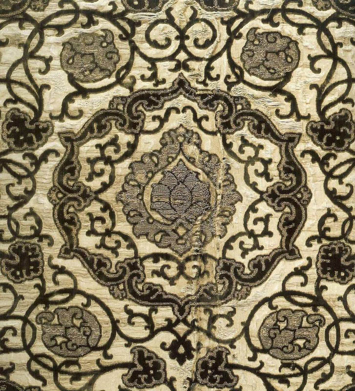 Patterned velvet on silver ground with silver and gold brocade effect