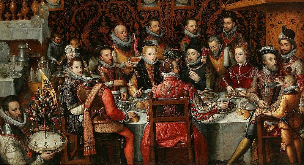 King Philip II of Spain banqueting with his family and courtiers