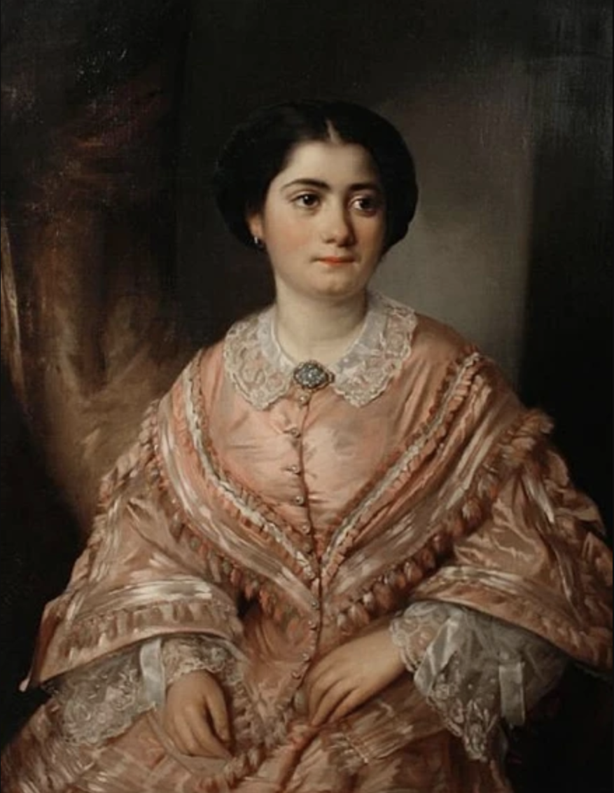 Portrait of a young woman, seated, wearing a pink dress