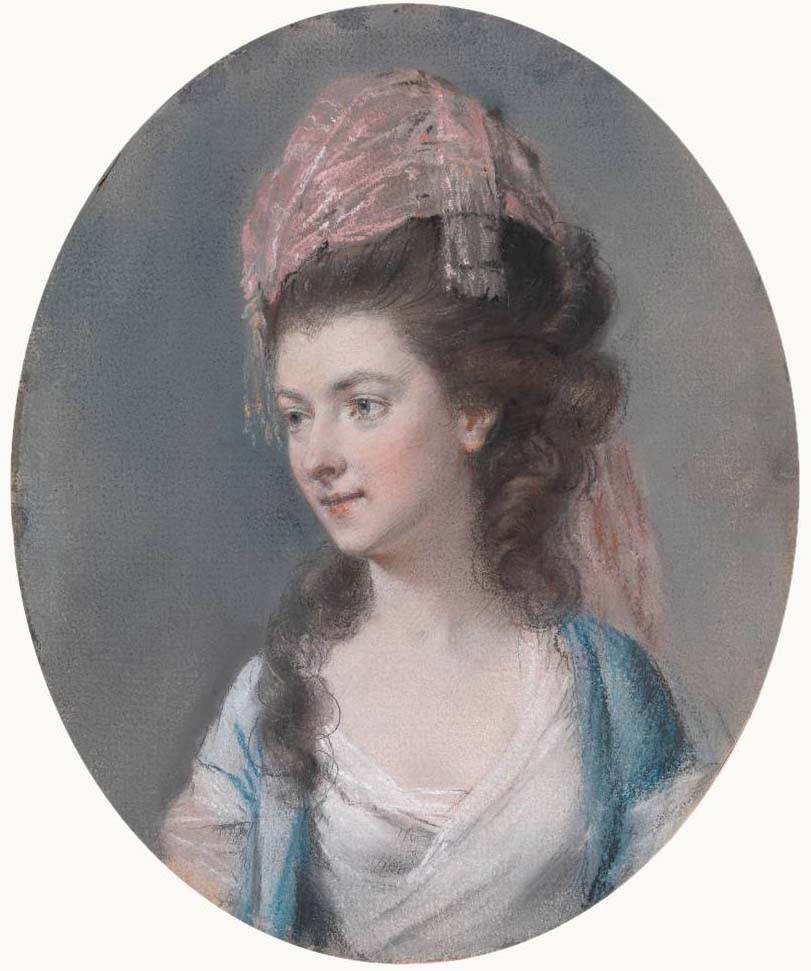 A lady wearing a pink turban