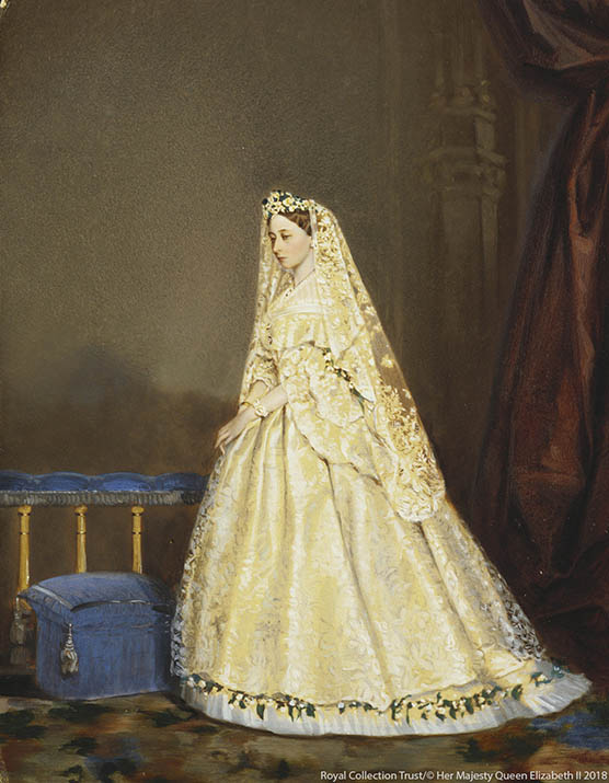 Hand coloured photograph of Princess Louis of Hesse and by Rhine standing at an altar in her wedding dress