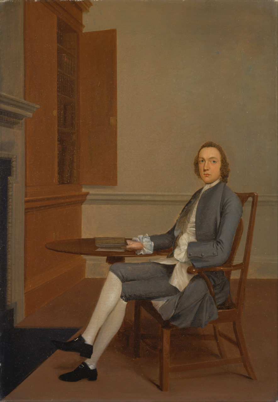 An Unknown Man Seated at a Table